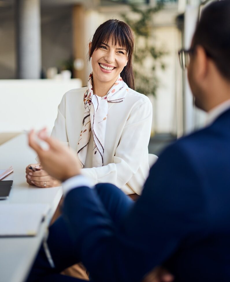 [ IMAGE ] Career professionals collaborating — warm, editorial, real people. Leave negative space at upper-right.